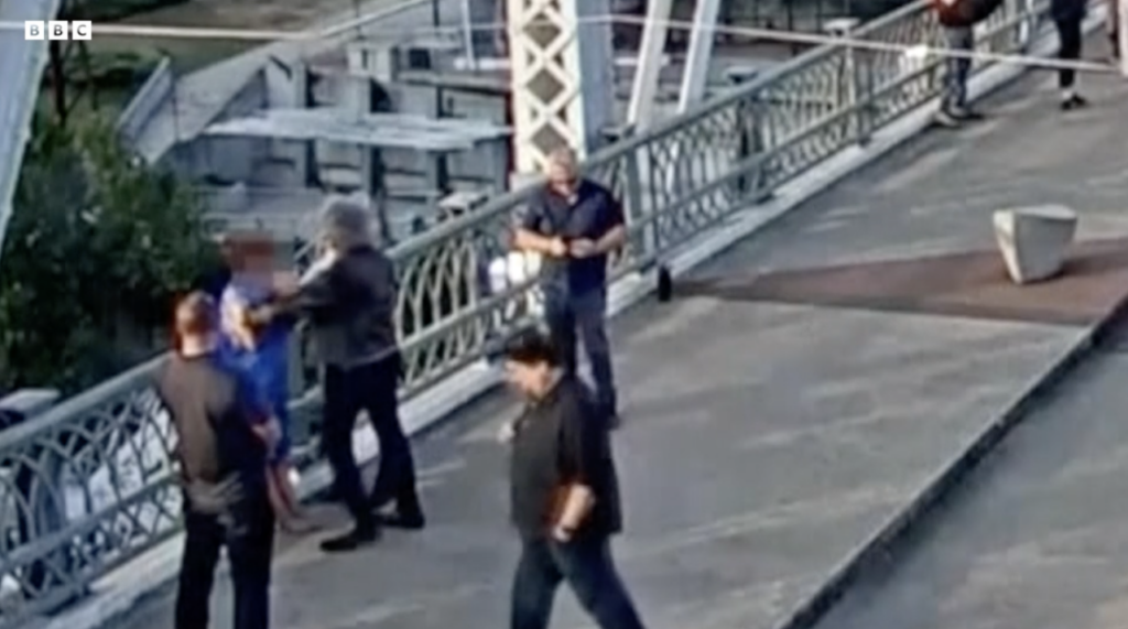Jon Bon Jovi talking to a woman on the John Seigenthaler Pedestrian Bridge